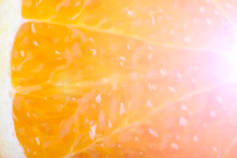 Light slice of orange macro closeup Stock Photos