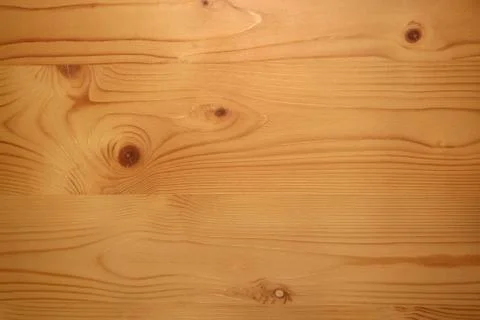 Light smooth boards with knots as a background. Stock Photos