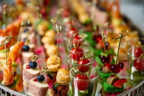 Light snacks, canap s with lard, cheese, meat, sauce, cherry tomatoes. Snacks Stock Photos