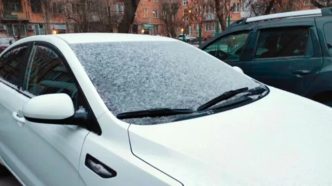 Light snow on the car and grass, yellow trees around Stock Footage 220926845