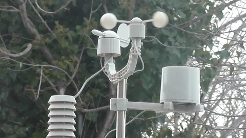 Light snow falling around a weather monitor Stock Footage 92481204