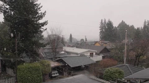 Light snow falling on residential rooftops in Vancouver, British Columbia Stock Footage 59111465