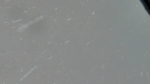 Light snow falling from the sky Stock Footage 125555399