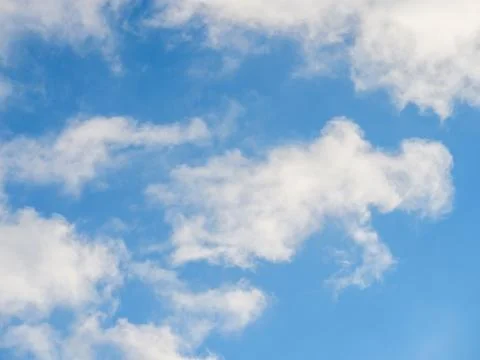 Light soft clouds against a blue sky Stock Photos