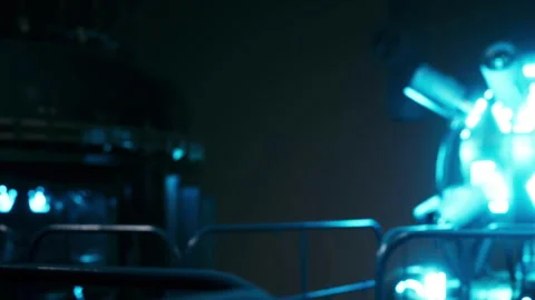 Light source in dark room with machinery and equipment near it Stock Footage 344994196