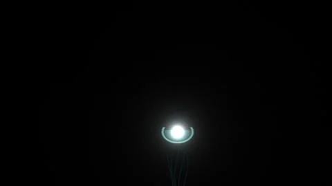 Light source with glowing effect and swirling particles in Stock Footage 339017728