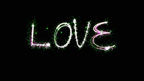 Light sparkling particles Text LOVE on black background. Stock Footage 155953447