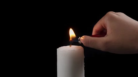 Light a spinning candle isolated black background 库存影片 279039737
