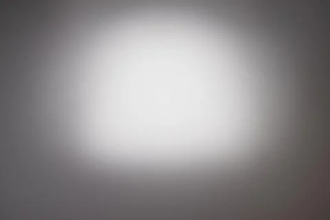 Light spot on a gray or gray background Stock Photos