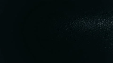 Light spot moving horizontally over dark black structured background pattern Stock Footage 146158700