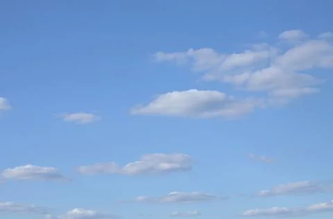 Light spring clouds, against the blue sky. Stock Photos