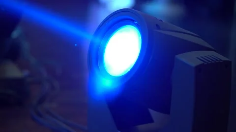 The light of a stage light projection beam shines upwards. Close-up Stock Footage 130244012