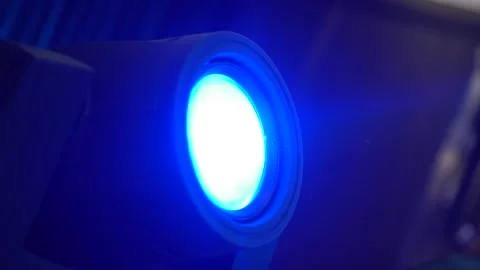 The light of a stage light projection beam shines upwards. Close-up Stock Footage 130244532