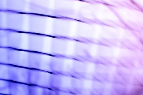 Light streaks create soft abstract pattern in shades of blue and purple. Bl.. Stockfoto's