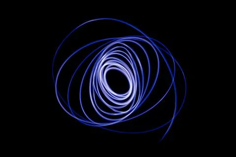 Light streaks in the shape of circles. A trace of a moving light point. Stock Photos