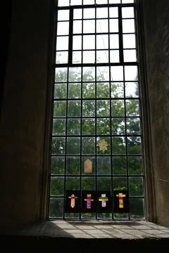 Light streaming through a leaded window in a church Stock Photos