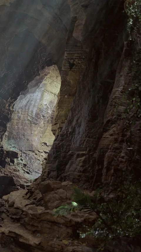 Light streams through a cave in the mountains during the day Stock Footage 334173932