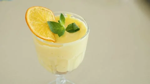 Light summer dessert with orange and mint 스톡 동영상 239932089