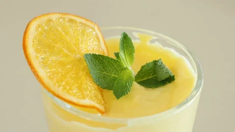 Light summer dessert with orange and mint Stock Footage 239932091