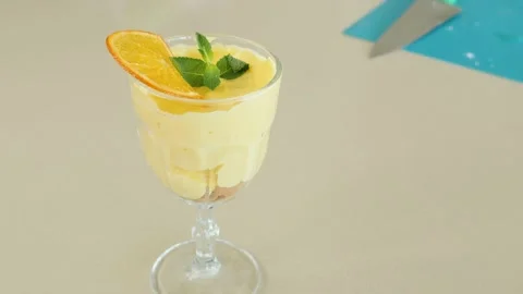 Light summer dessert with orange and mint Stock Footage 239932093