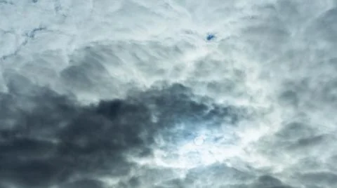 The light of the sun shining through the clouds in the sky. Amazing of fluffy Stock Photos