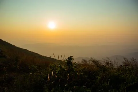 Light sunset behind the mountains Nern Chang Suek  hills, Kanchanaburi, Thail Stock Photos