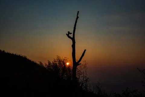 Light sunset behind the mountains Nern Chang Suek  hills, Kanchanaburi, Thail Stock Photos