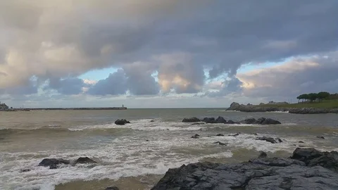 Light surf in the evening in the bay Castro-Urdiales, North Spain Stock Footage 79142808