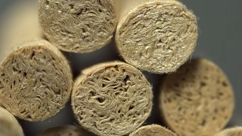 Light sweep natural cigarette brown filters macro close up isolated Stock Footage 119079876