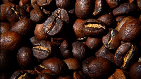 Light Sweep Over Roasted Coffee Beans With Falling Grains Slow Motion Stock Footage 323401188