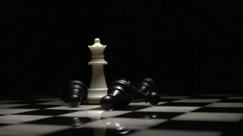 Light Sweep Over White Queen and Fallen Black Pawns 2 Stock Footage 61405582