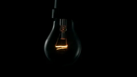 Light swinging. 4k Black background Stock Footage 89649025