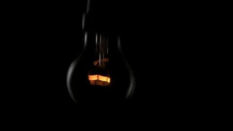 Light swinging. Black background 4k Stock Footage 89649029