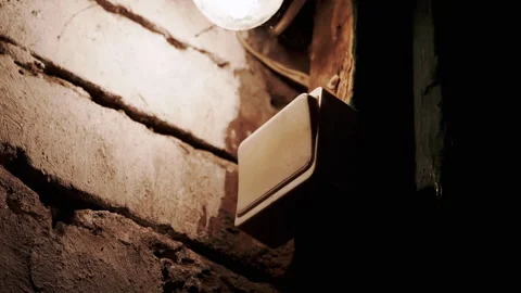 Light Switch and Bulb in Dark Room Stock-Footage 293152620