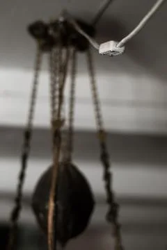 Light switch and old lamp hanging from the ceiling Stock Photos