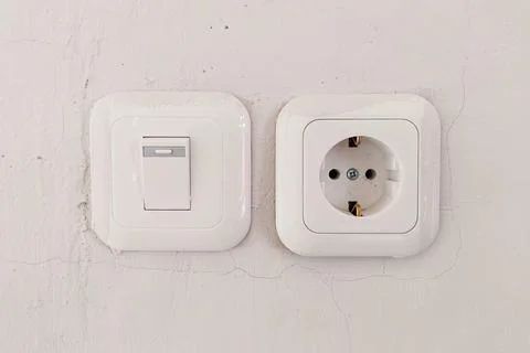 Light switch and power outlet Stock Photos
