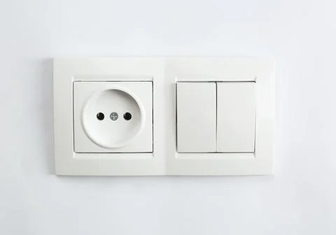 Light switch and power socket on white background. Electrician's equipment Stock Photos