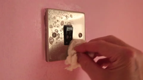 Light switch being wiped down in domestic house Stock Footage 142387580