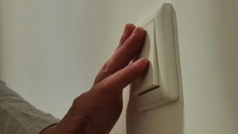 Light switch. Electrical switch. hand palm presses the electric switch button Stock Footage 248533204