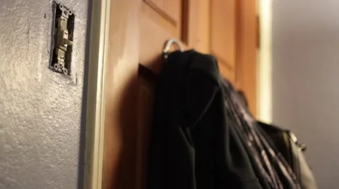 Light switch to hanging sweater focus Stock Footage 47526347
