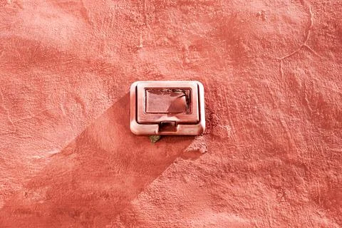 Light switch on old red wall . Electric component Stock Photos