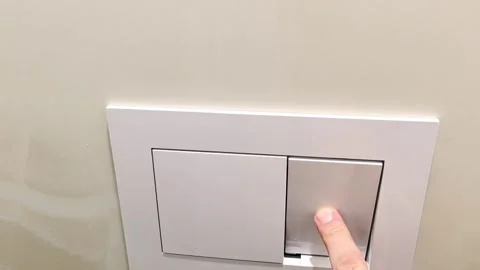 Light switch operation and details in home setting during daytime Stock Footage 325804918