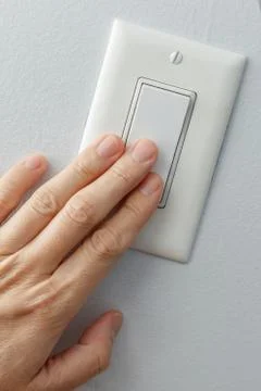 Light switch on or off Stock Photos