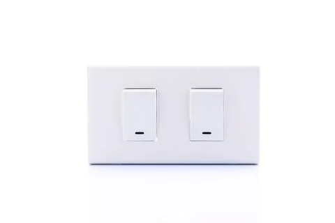 Light switch placed on a white background. Stock Photos