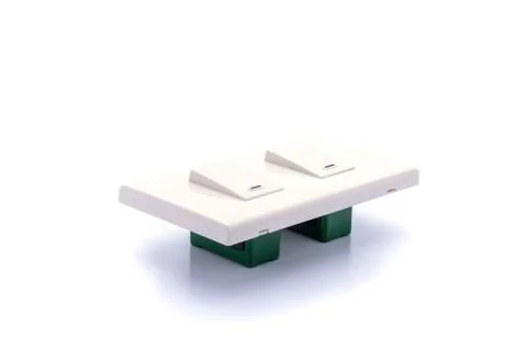 Light switch placed on a white background. Stock Photos