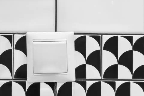 Light switch on tile Stock Photos