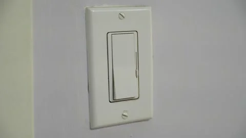 Light switch turning on and off, lamp illumination, indoor lighting Stock Footage 346499197