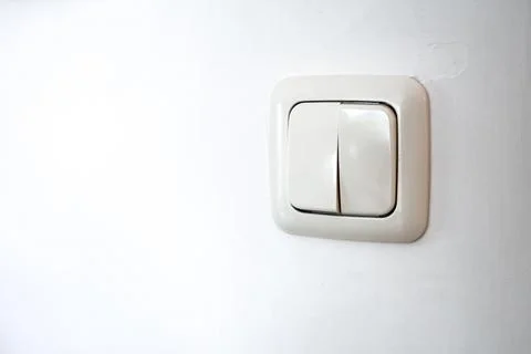 Light switch turning on electrical power in home Stock Photos