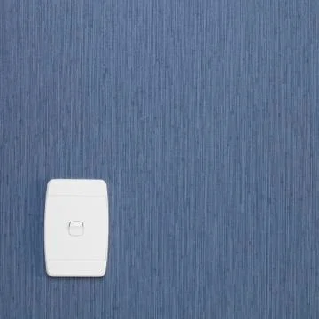 Light switch on wall with blue wallpaper, square, copy space Stock Photos