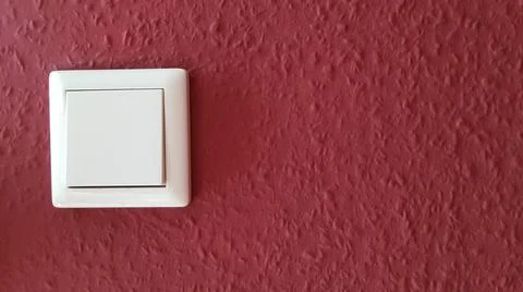 Light switch on the wall Stock Photos